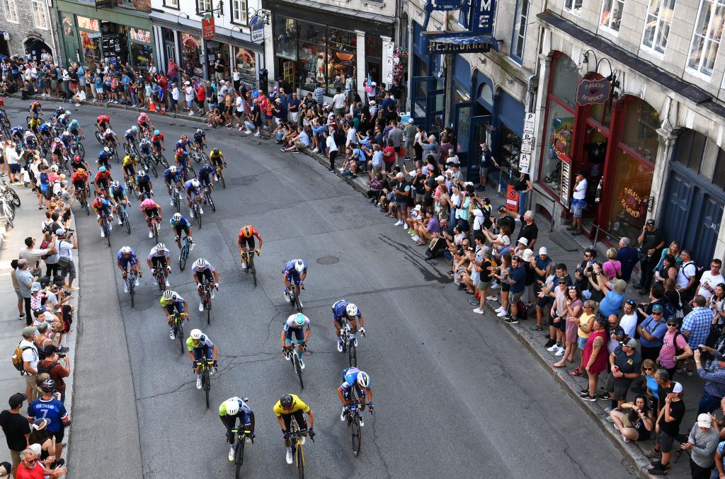 QUEBEC CITY QUEBEC SEPTEMBER 13 A general view of the peloton competing while fans cheer during the 13th Grand Prix Cycliste de Quebec 2024 a 2016km one day race from Quebec City to Quebec City UCIWT on September 13 2024 in Quebec City Quebec Photo by Alex BroadwayGetty Images