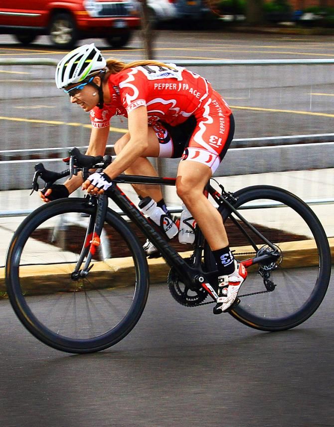 Tracy Cameron (Pepper Palace Pro Cycling) gives Morgan Brown a hand, but to no avail.