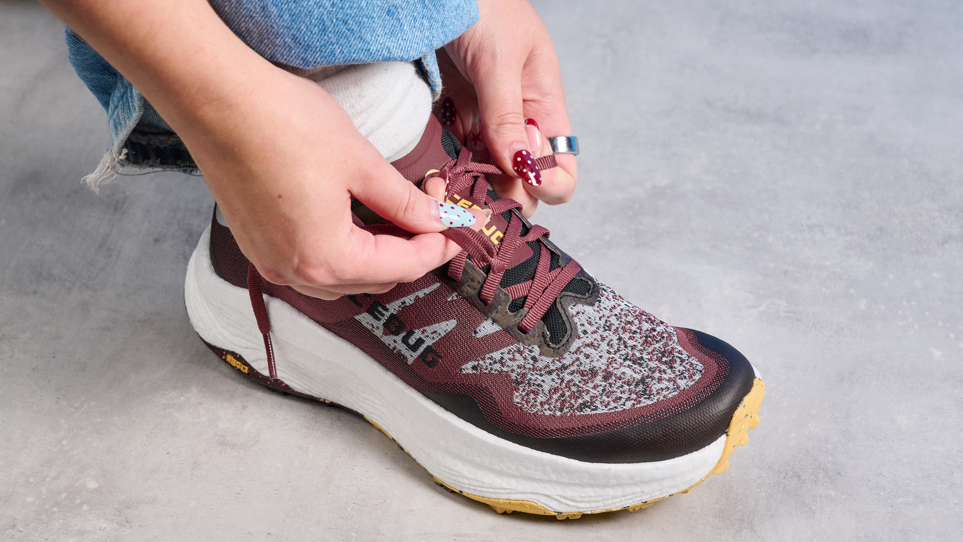 the icebug j&amp;auml;rv rb9x trail running shoes in cherry and banana photographed against the tom's guide blue background
