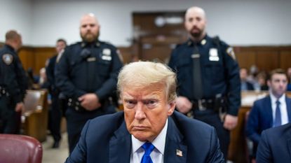 Former President Donald Trump sits in a Manhattan courthouse