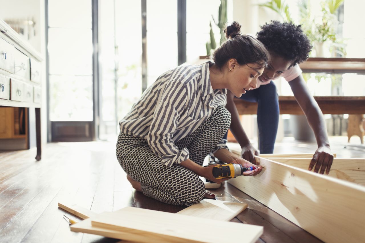 Couple building flatpack furniture