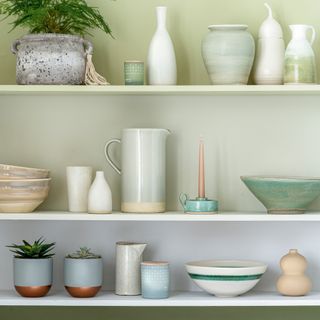 Green ombre shelves with plates and pots