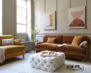 Loaf illustrate cozy living room ideas with a orange sofas in a neutral color scheme.