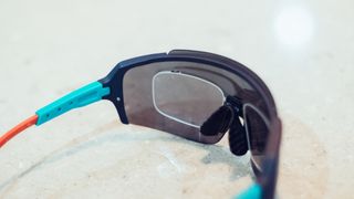 A pair of the best prescription cycling glasses with prescription inserts behind the main lenses