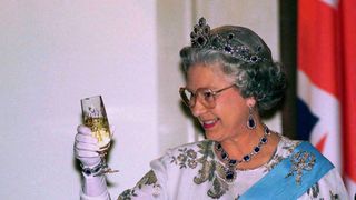 warsaw, poland march 25 queen at banquet at presidential palace toasting her host with a glass of champagne in warsaw during her visit to poland photo by tim graham photo library via getty images