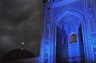 The Friday Mosque in Yazd, Iran, lit up in blue