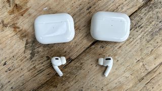 Apple AirPods Pro 2 bud and case next to original AirPods Pro bud and case