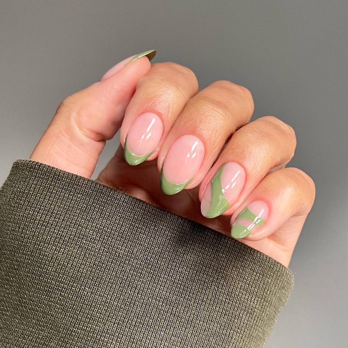 Green negative space manicure design