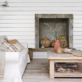 living room with white sofa and wood coffee table with wall cladding