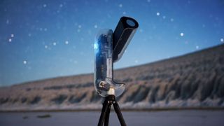 The Vaonis Vespera II - X edition pointing at the sky with a hill and starry night in the background.