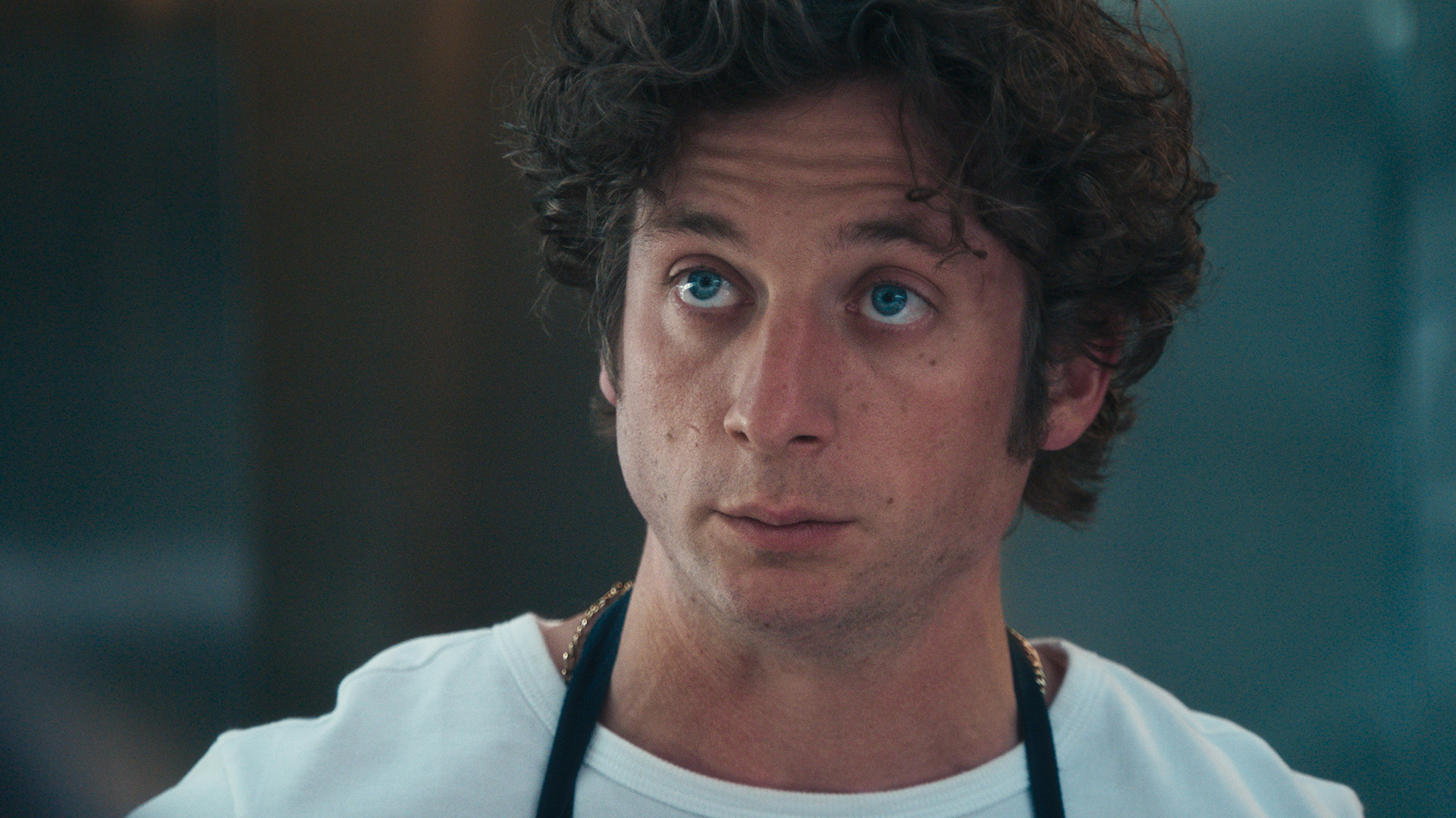 A close up of a serious-looking Carmy in The Bear season 4