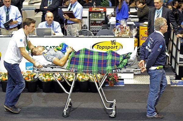 Peter Schep is taken for medical checks after feeling unwell during the team elimination race.