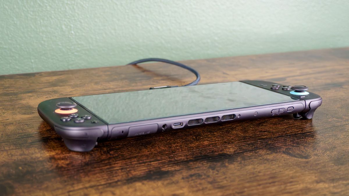 A Switch 2 plugged into the Genki Covert Dock 3 and connected to a TV