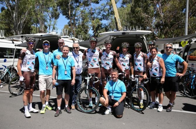Riders and staff from Ag2r-La Mondiale celebrate getting through the 2014 edition of the race