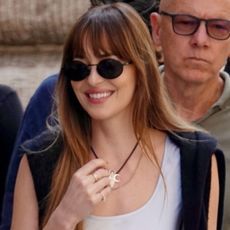 Dakota Johnson wore a silk slip dress with the ballet flats trend