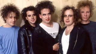 The Cure posing for a photograph in 1990