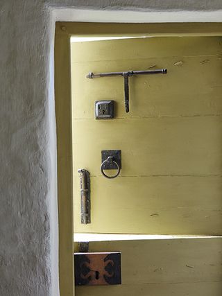 door with salvaged fittings