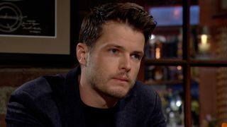 Michael Mealor as Kyle Abbott sitting and thinking in The Young and the Restless