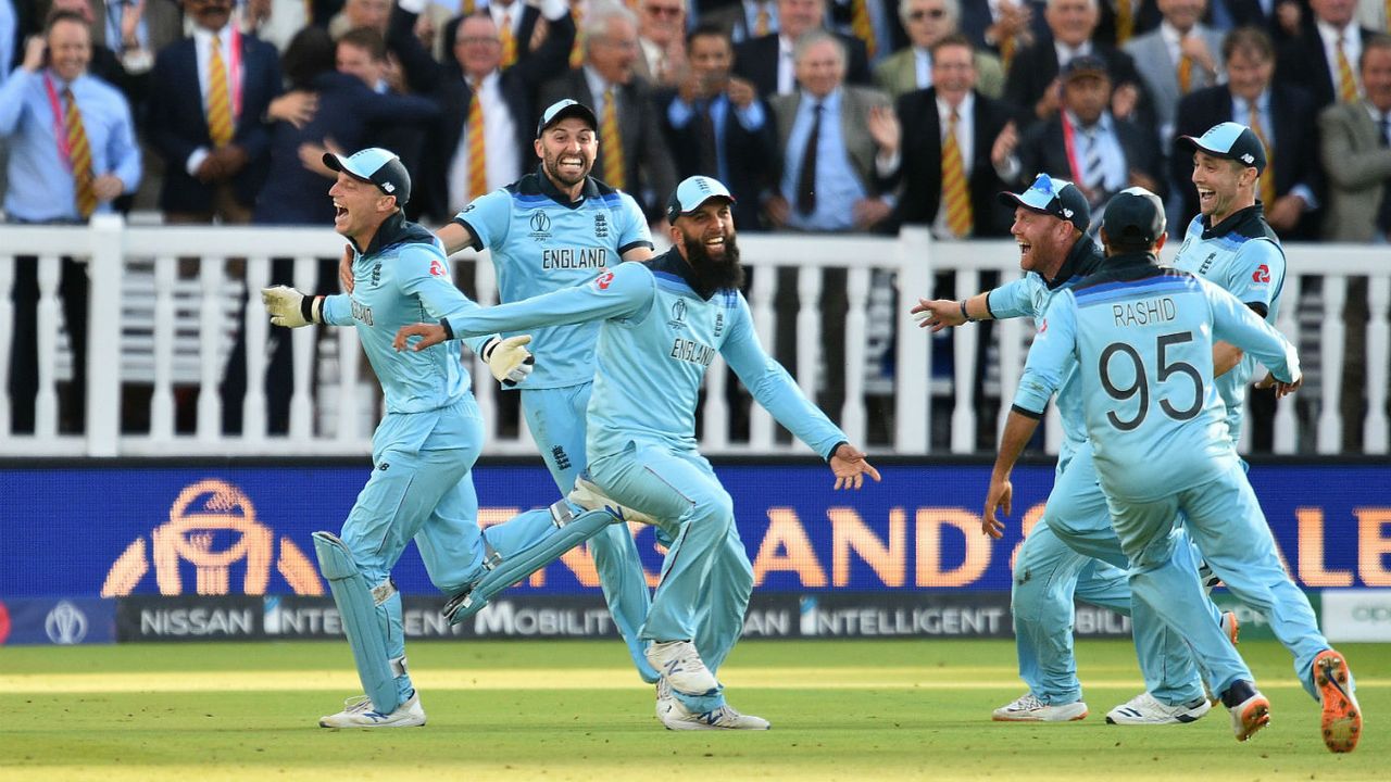 England wicketkeeper Jos Buttler celebrates with his team-mates after the win over New Zealand