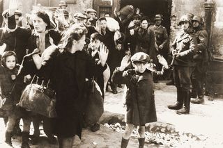 Jews were captured and forcibly pulled out from dugouts by the Germans during the Warsaw Ghetto uprising.