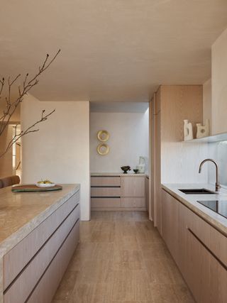 A kitchen in muted tones, designed in all wood