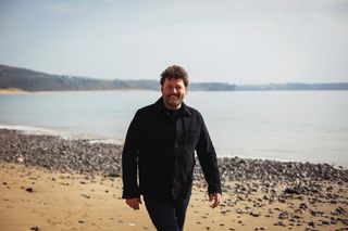 Enjoy a beach stroll in Wonderful Wales With Michael Ball.