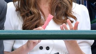 Kate Middleton holding Clarins Lip Balm