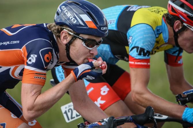 Craig Lewis (Champion System) has a snack while riding in the break.