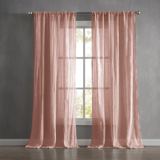 Peach color sheer curtains.