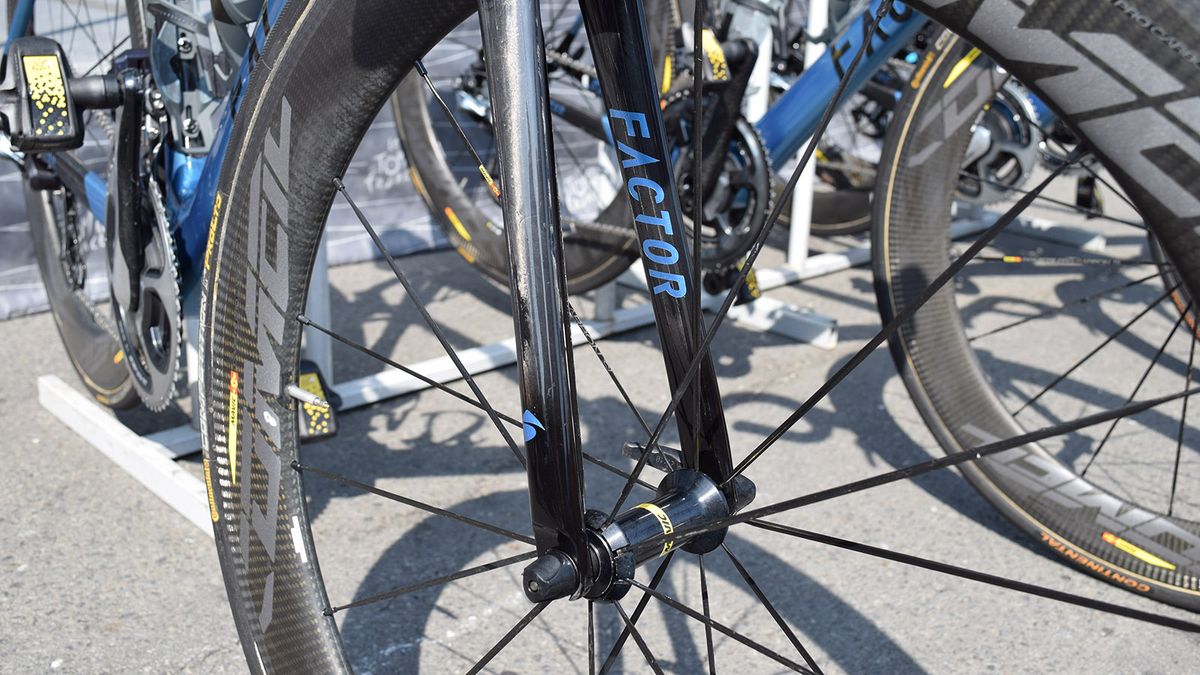 In reverse to the frame design, blue decals adorn black forks on Latour's bike