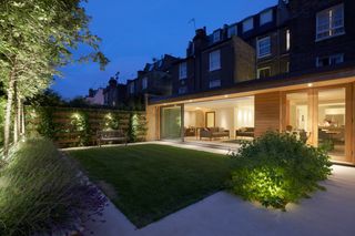 a modern garden with simple lighting ideas