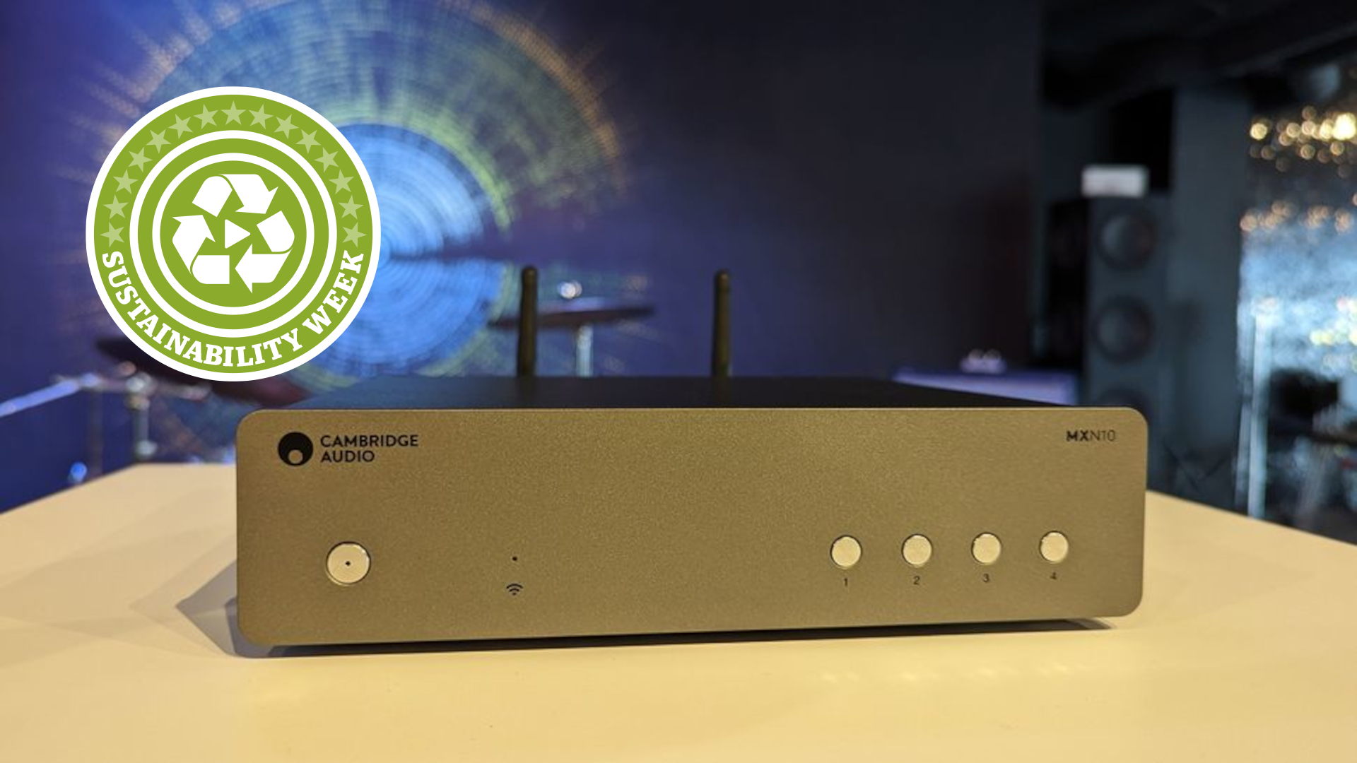 Cambridge Audio Streamer on table with Sustainability Week logo