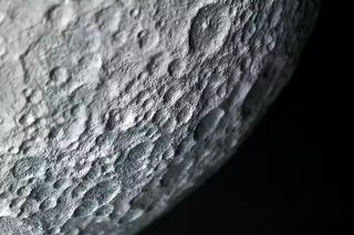 partial view of the close up moon with lots of craters