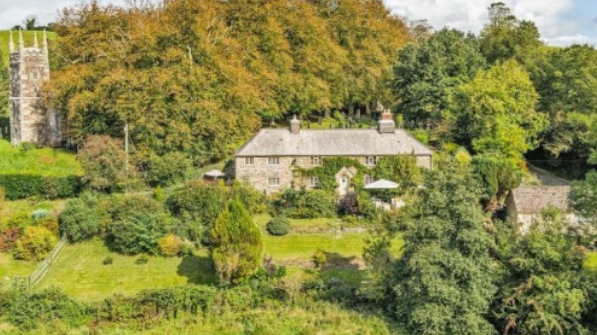 Cottage with surrounding foliage