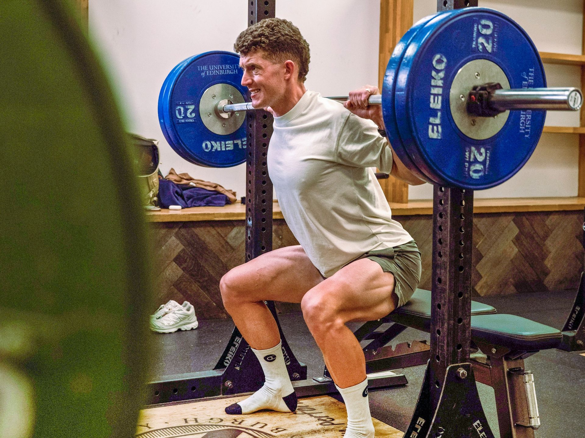 Cyclist squatting in the gym
