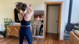 The author doing a workout class with the FITURE Interactive Smart Fitness Mirror workout class