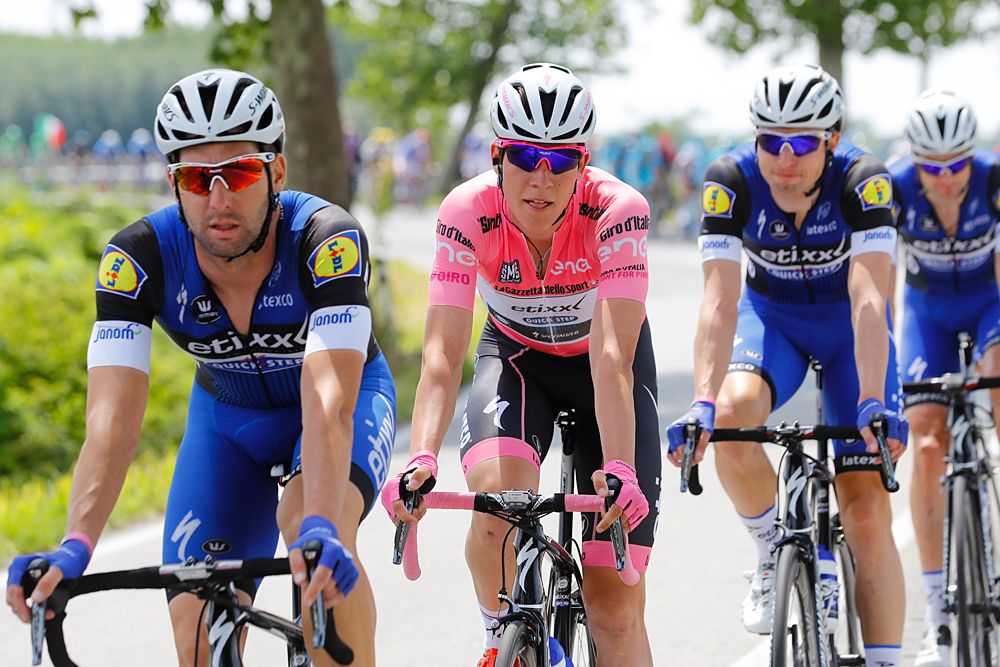 Luxembourg's rider Bob Jungels (C) of Etixx - Quick Step rides with teammates in the peloton during the 11th stage of the 99th Giro d'Italia
