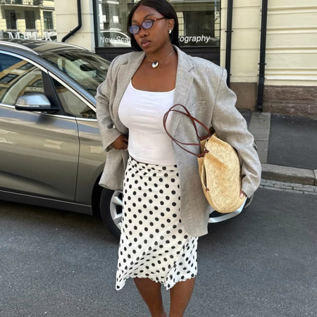 Nnenna in midi skirt, blazer and basket bag