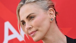 Charlize Theron is pictured with a soft coral-pink blush applied to her cheekbones whilst attending the Charlize Theron Africa Outreach Project 2024 Block Party at Universal Studios Backlot on July 13, 2024 in Universal City, California.