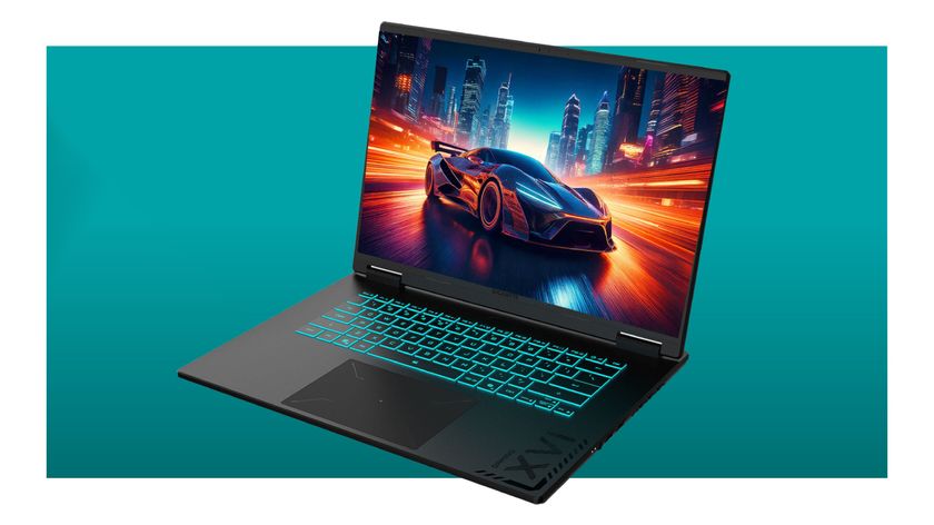 A Gigabyte Gaming A16 laptop on a teal deals background