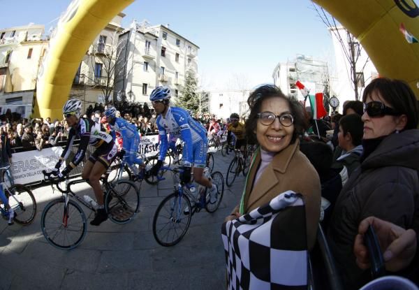 The local mayor looks happy as the riders roll out
