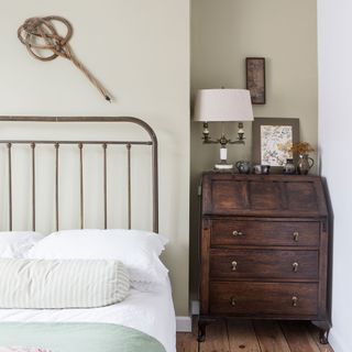 guest bedroom with wooden floor and wooden cabinet