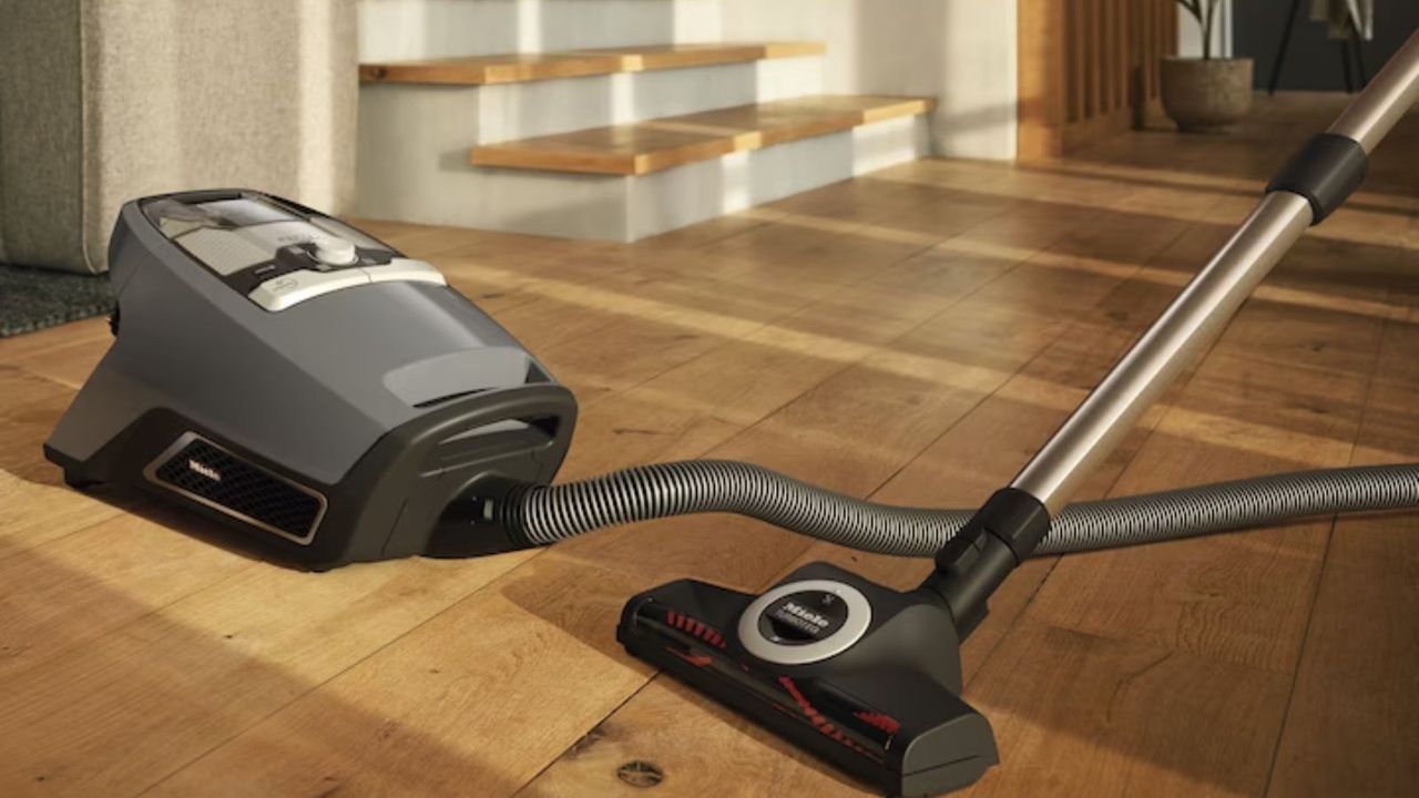 Miele Blizzard CX1 Cat &amp; Dog canister vacuum on wooden floor