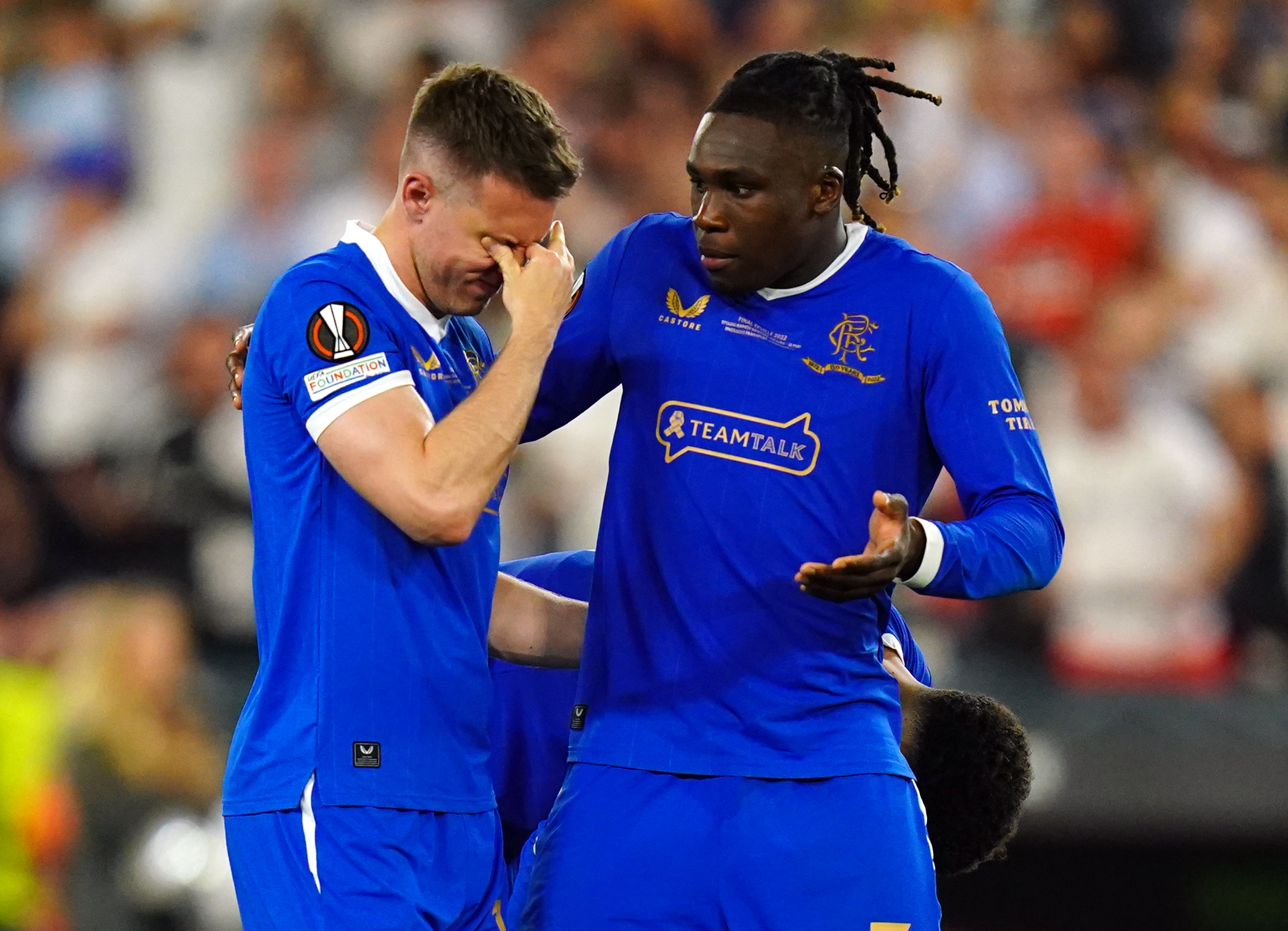 Rangers’ Aaron Ramsey stands dejected with Calvin Bassey