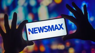 The Newsmax logo seen displayed on a smartphone.