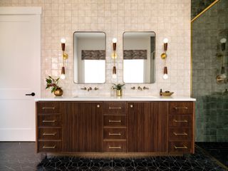 a dark wood bathroom vanity