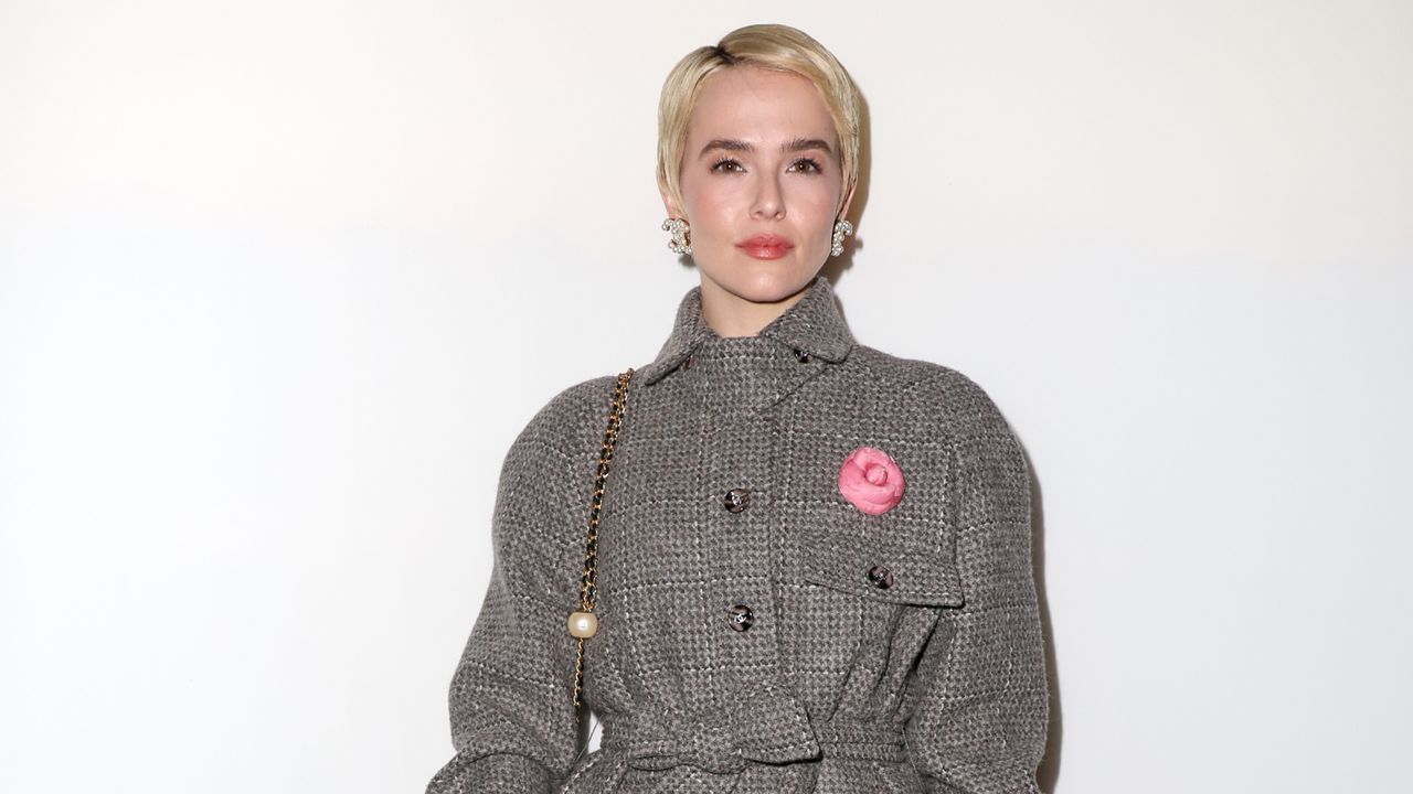 Zoey Deutch attends the chanel show with a platinum blonde pixie cut