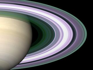 This simulated image of Saturn's rings uses color to indicate particle sizes in the ring bands.
