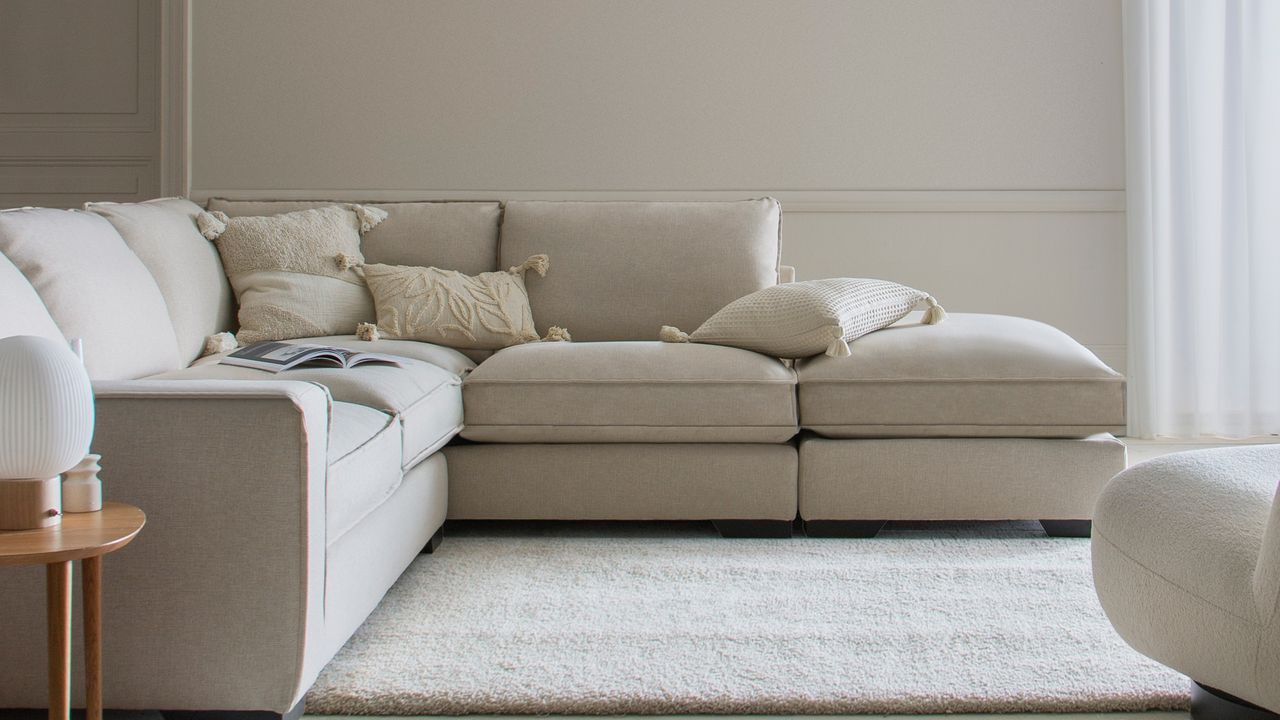 Cream sofa with grey carpet