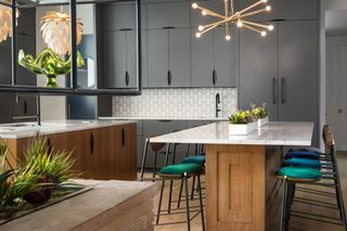 kitchen with double islands one with bar stools, breakfast bar, wooden elements